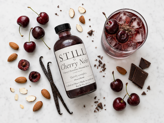 STILL Cherry Noir syrup with cherries, almonds, chocolate, and a cherry drink